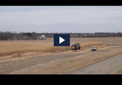 screen capture of a video showing a tractor in a field